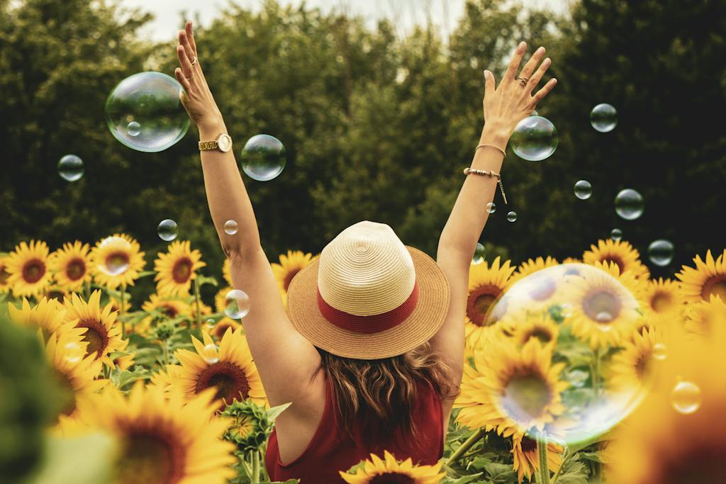 Happy woman surrounded by flowers