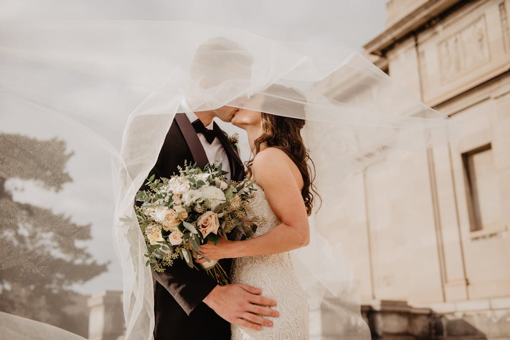 Bride and groom kissing at their wedding.